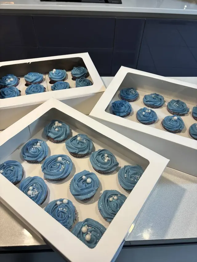 Blue glitter rosette cupcakes with pearls, boxed