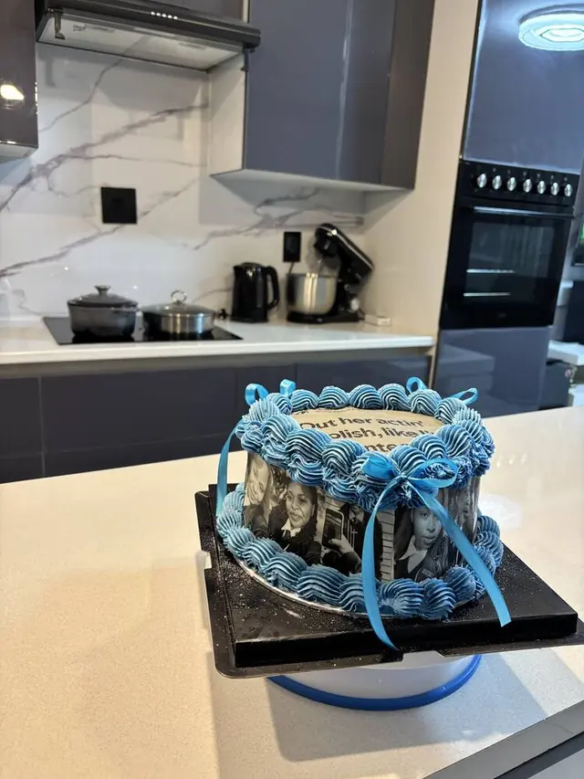 Blue cake with black and white photo print sides