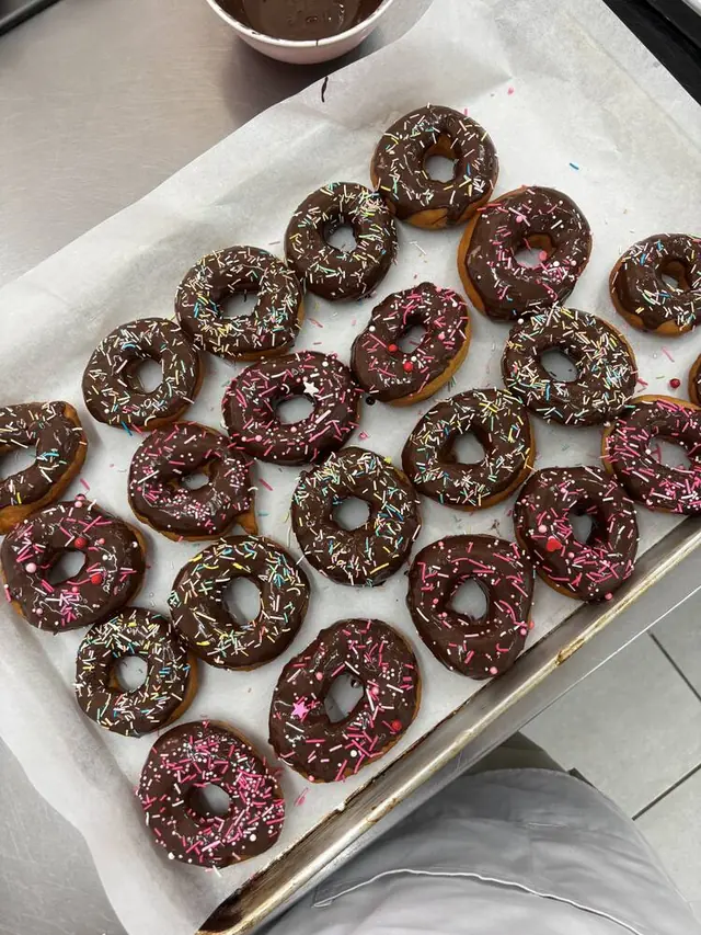Chocolate glazed donuts with sprinkles