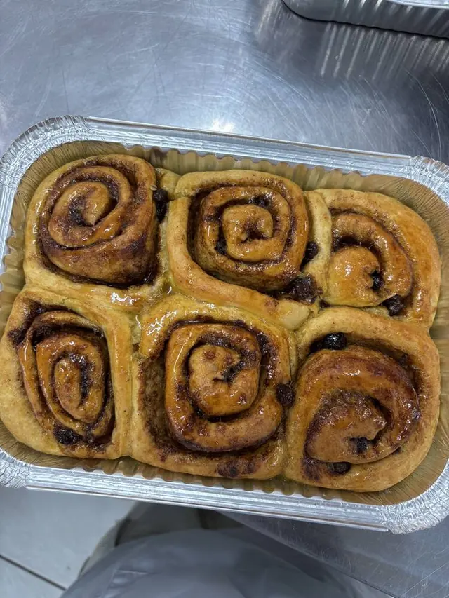 Glazed cinnamon rolls in a tray