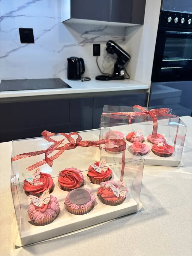 Pink rosette birthday cupcakes with butterfly toppers