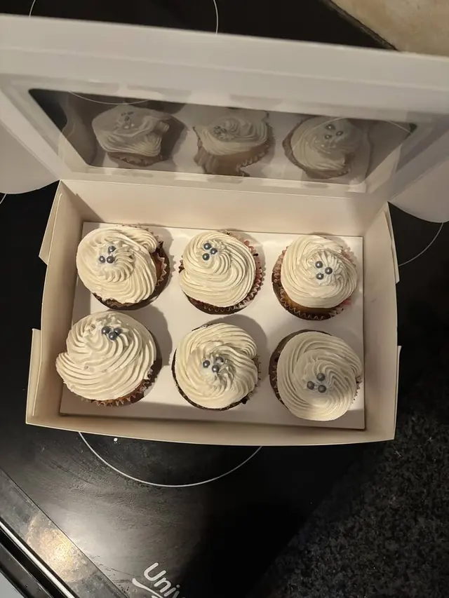 Cream cupcakes with silver pearl sprinkles, boxed
