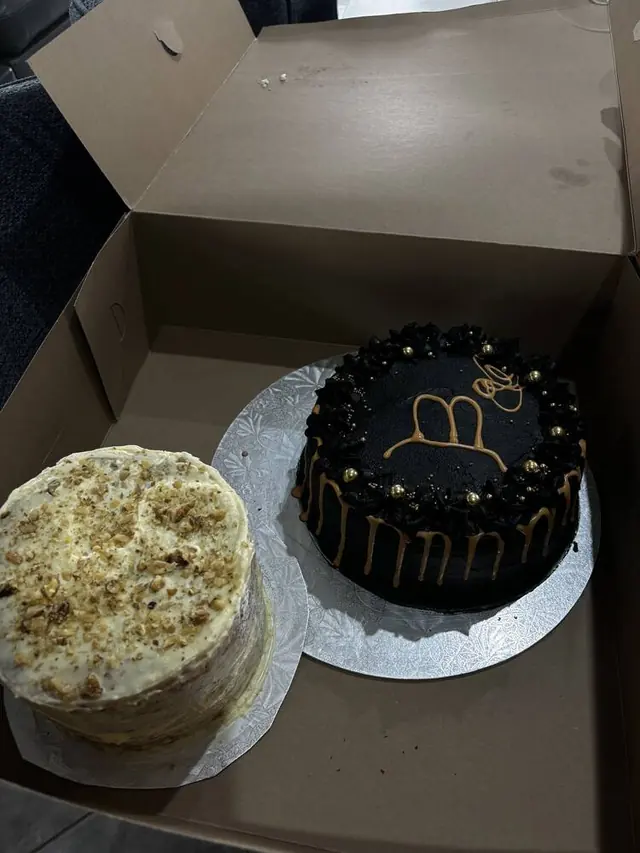 Carrot cake and black gold-drip cake side by side